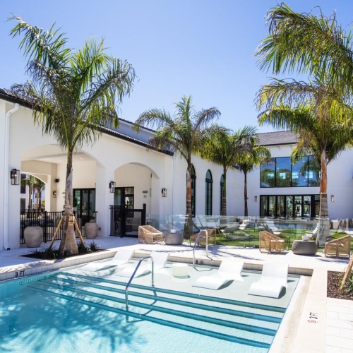 a pool with chairs around it