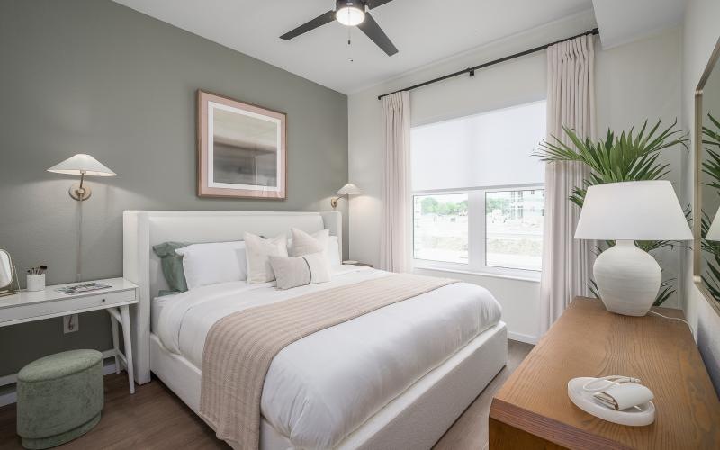 a bedroom with a large window