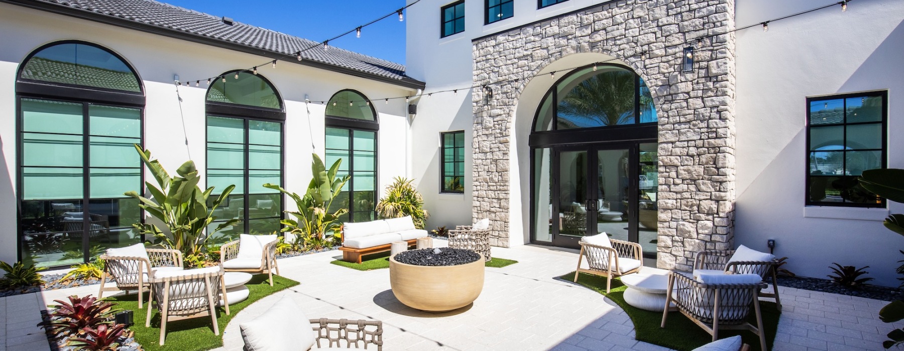 a patio with chairs and tables