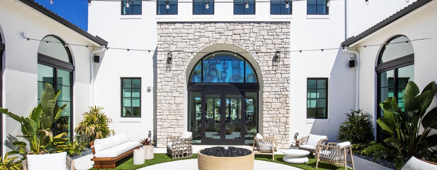 a courtyard with chairs and tables