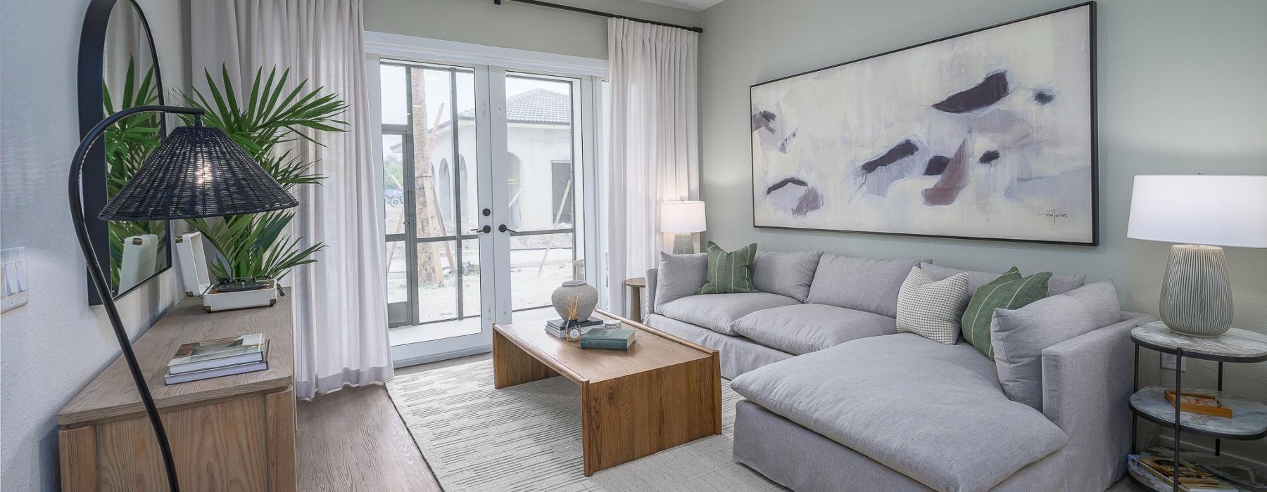 a living room with a fan and a couch
