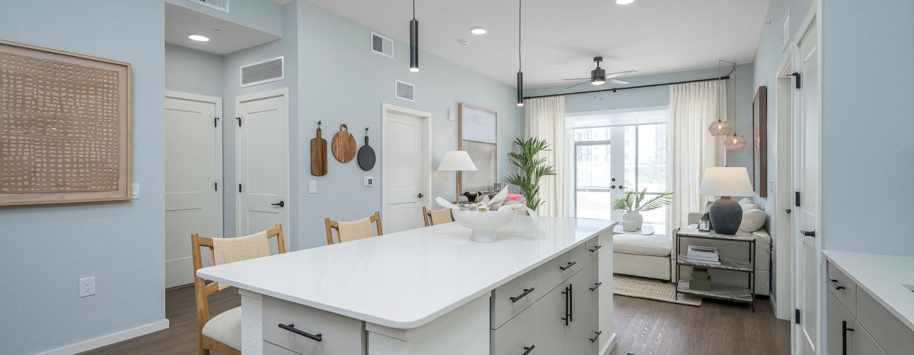 a kitchen with a white counter top