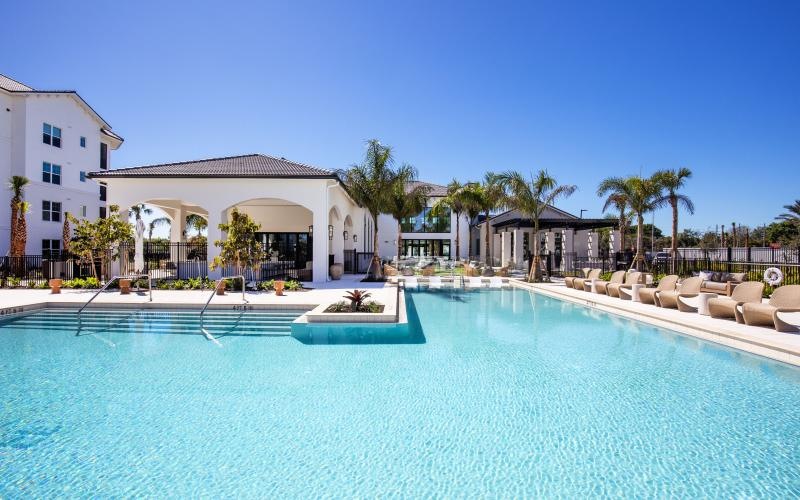 a swimming pool in front of a building