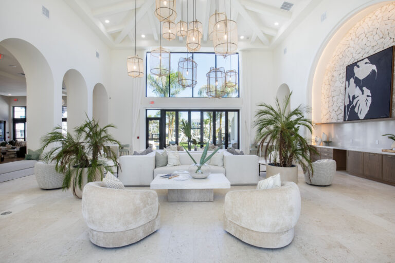 Bright social lounge with plants at Fiori Apartments