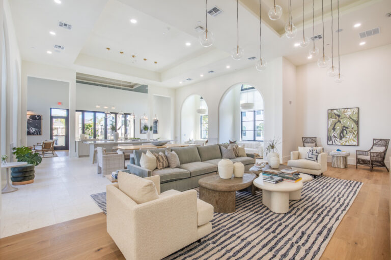 Spacious lounge with beige sofas at Fiori Apartments